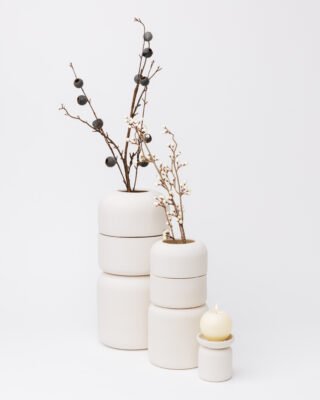Full-size and keepsake cremation urns shown for size comparison