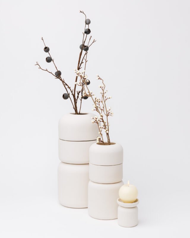 Full-size and keepsake cremation urns shown for size comparison